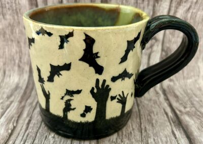 Halloween bats and Zombie Hands Mug, Martha Conan Pottery, Pottery, Upstate New York Pottery, Syracuse Pottery, Syracuse Potter, Central New York Pottery, Potters in Central New York, Best Potters in Syracuse. Best Pottery in Syracuse, Best Pottery in Upstate New York, Best Pottery in Central New York, CNY Pottery, local pottery CNY